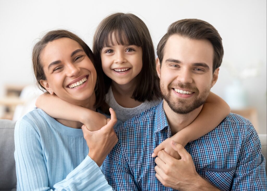 Joyful family showcasing healthy smiles, crafted and nurtured by Palm Beach Dental Specialists.
